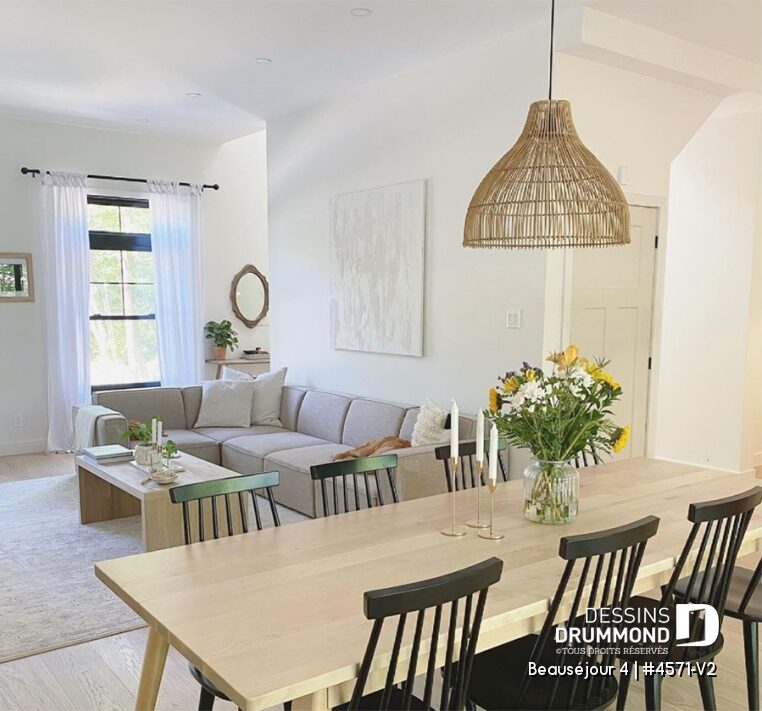 Salle à manger ouverte sur salon lumineux dans une maison de campagne moderne au Québec